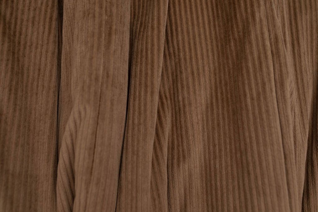A close up of a softly texture brown minky blanket.