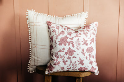 White and Pink floral pillows on stool