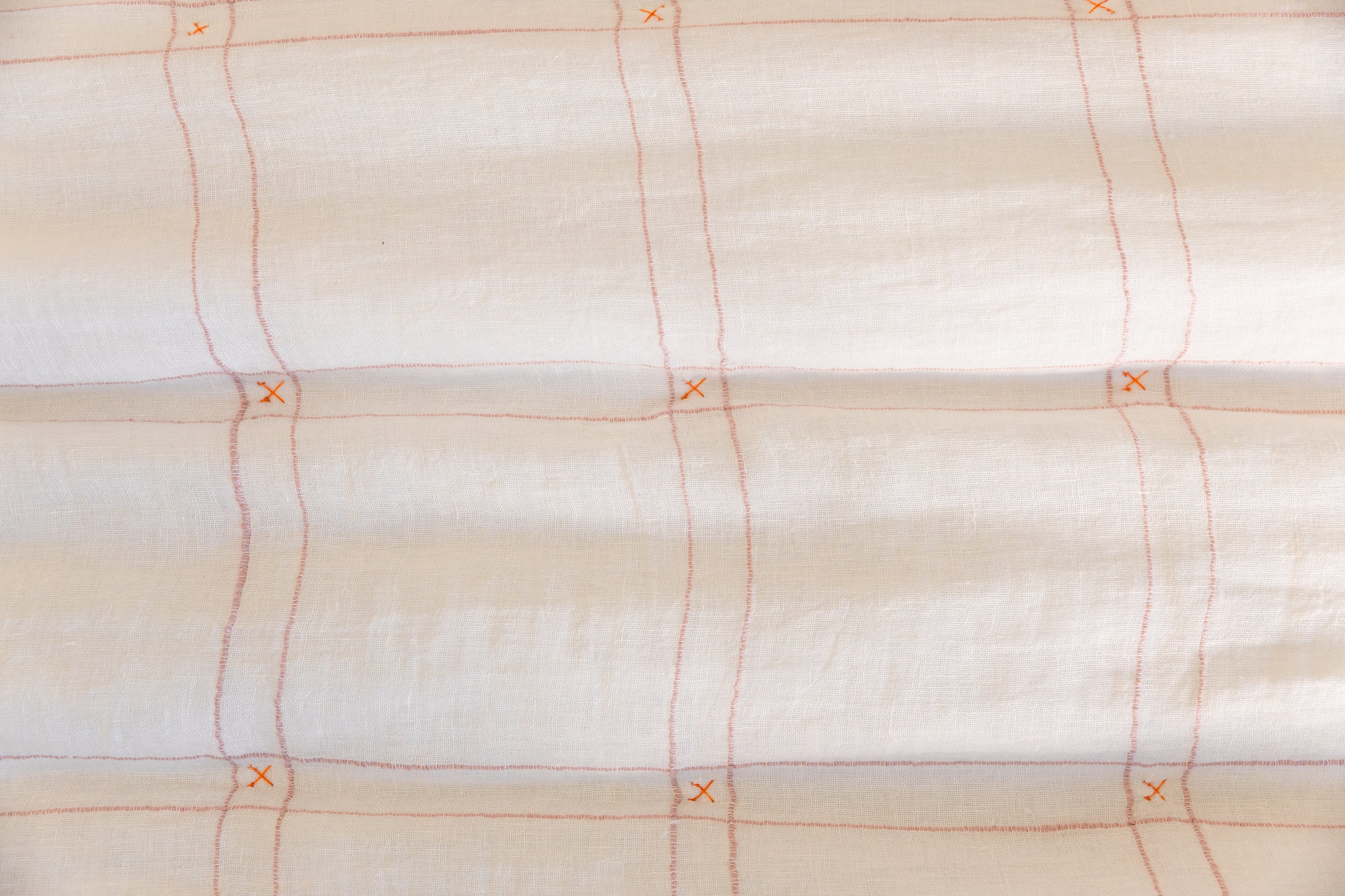 Blanket with white and pink grid pattern