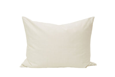 A cream pillowcase on a white background.