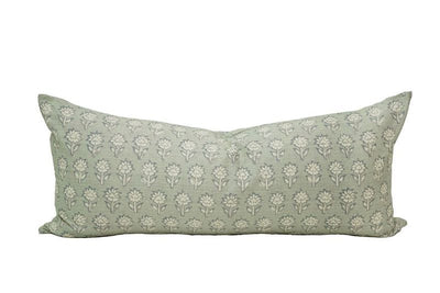 An XL lumbar pillow in a green-blue shade with a floral pattern