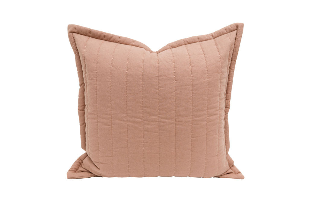 A terracotta quilted Euro pillow on a white background.