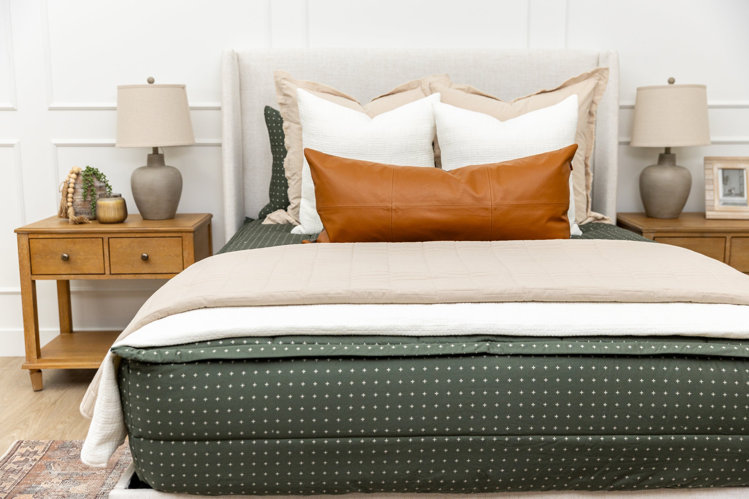 Green zipper bedding with white cream and tan accessories