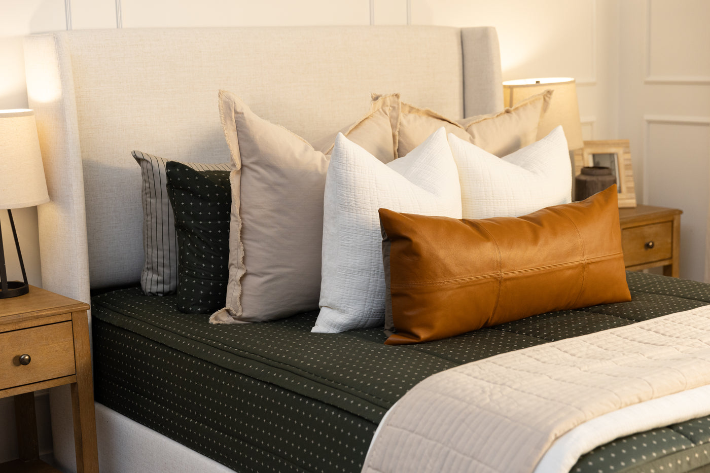 Green zipper bedding with tan and white accessories