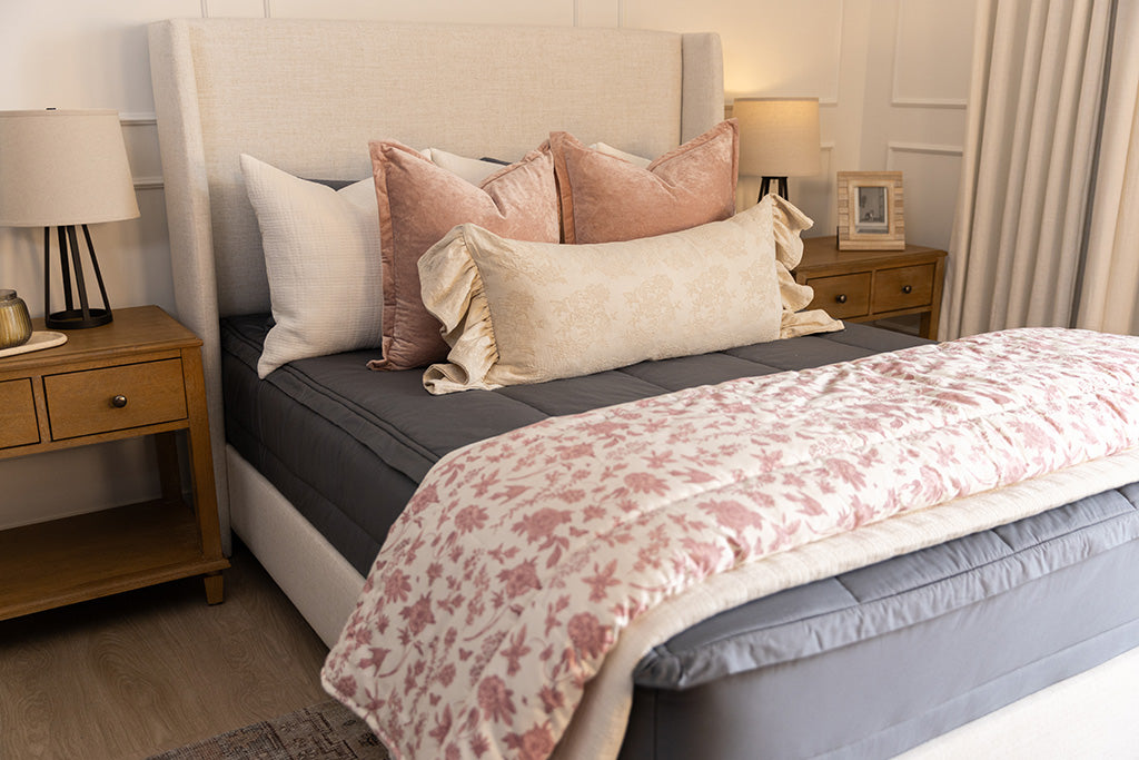 Classic gray zipper bedding with pink, cream, and white accessories.
