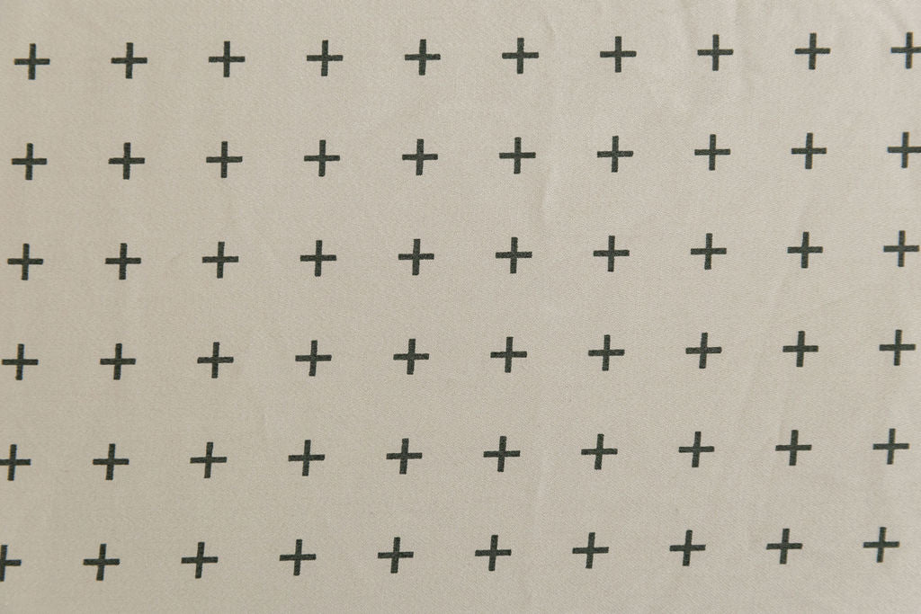 A close up view of a khaki crosshatch cotton patterned interior of a zipper bedding.