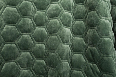 A close up of an emerald honeycomb pattern velvet blanket.