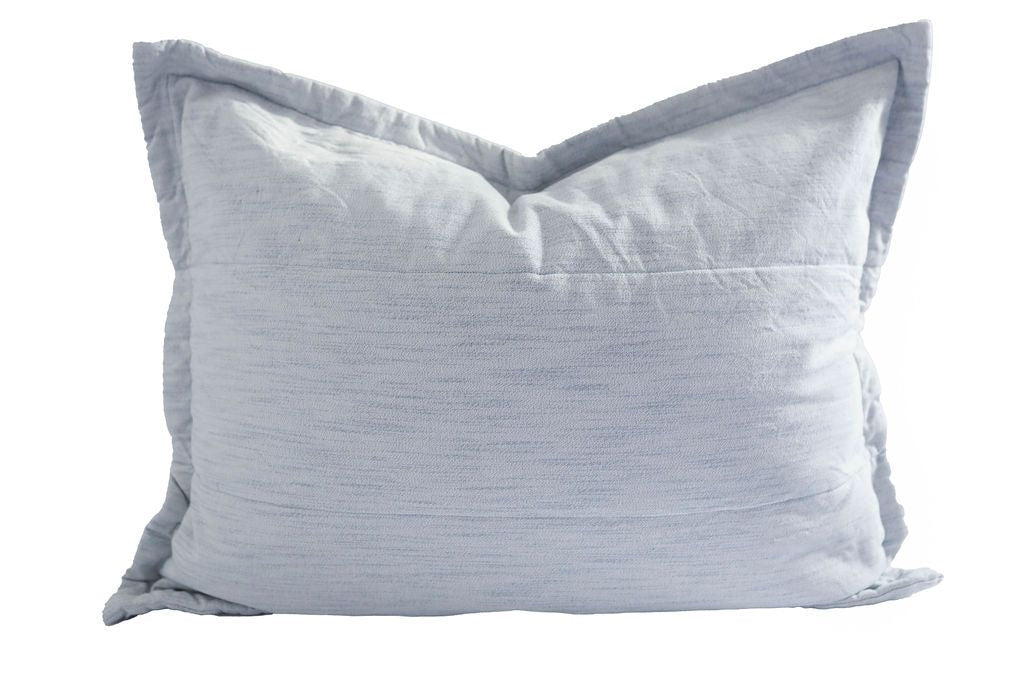 A light blue sham pillow.