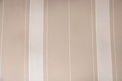 A close up view of a tan striped interior of a tan zipper bedding.