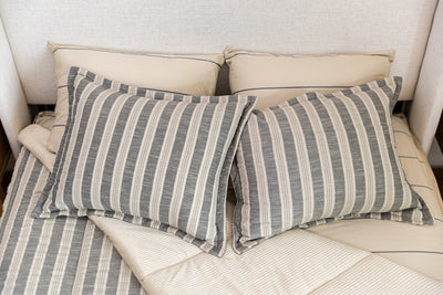 Overhead photo of classic stripe zipper bedding with distressed gray striped bed sheets and tan corduroy minky interior.