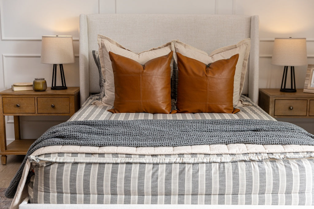 Classic stripe with calming neutrals zipper bedding with tan, gray and rustic accessories.
