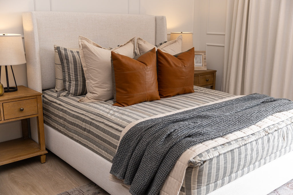 Classic stripe with calming neutrals zipper bedding with tan, gray and rustic accessories.