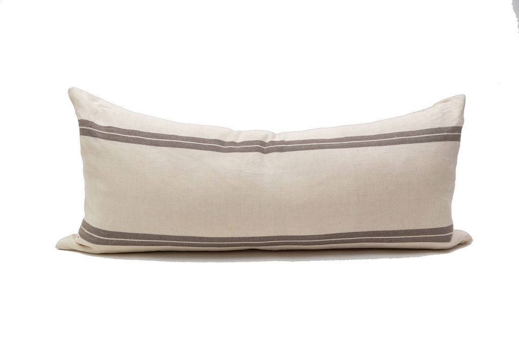 A cream and brown striped XL lumbar pillow cover