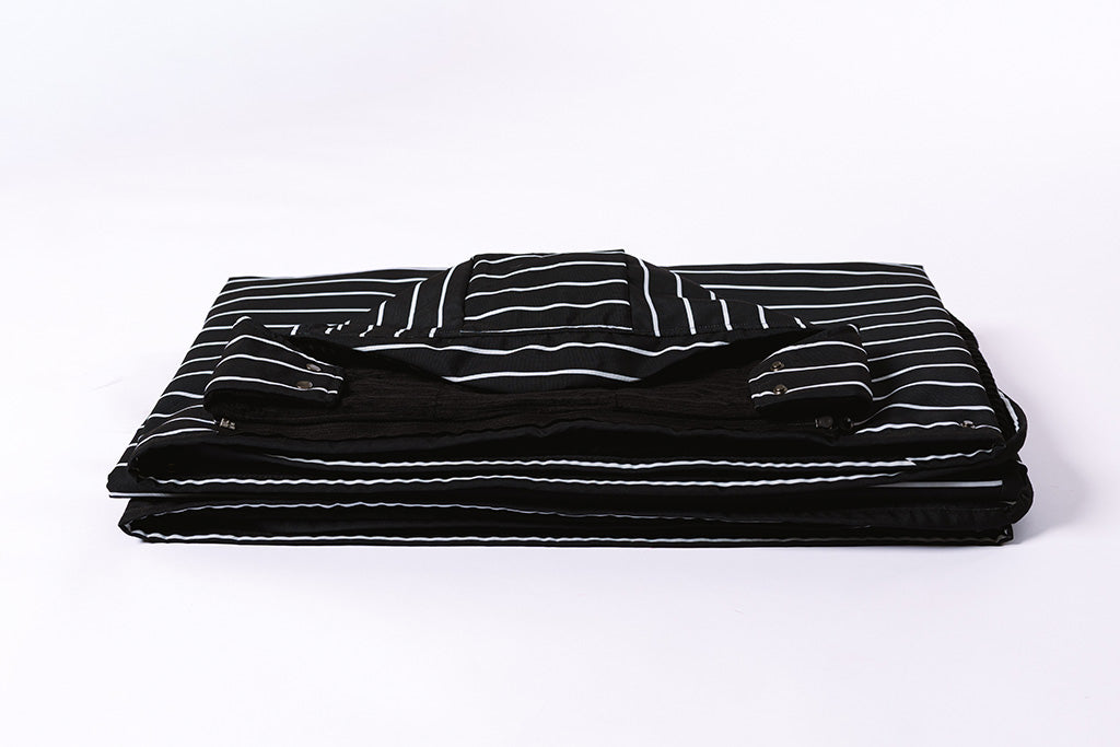 Beddy's water and wind resistant stadium blanket folded on a white background.