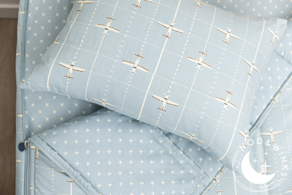 light blue zipper bedding with airplane design
