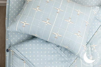 light blue zipper bedding with airplane design

