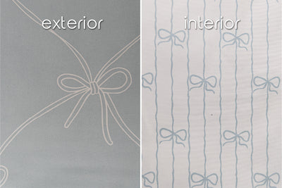 A close up of the exterior and interior fabrics of a set of bows zipper bedding, showcasing the large and small bow prints.