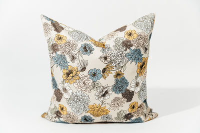 A multicolor floral euro patterned pillow arranged on a white background.