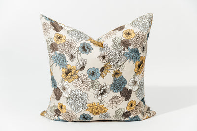 A multicolor floral euro patterned pillow arranged on a white background.