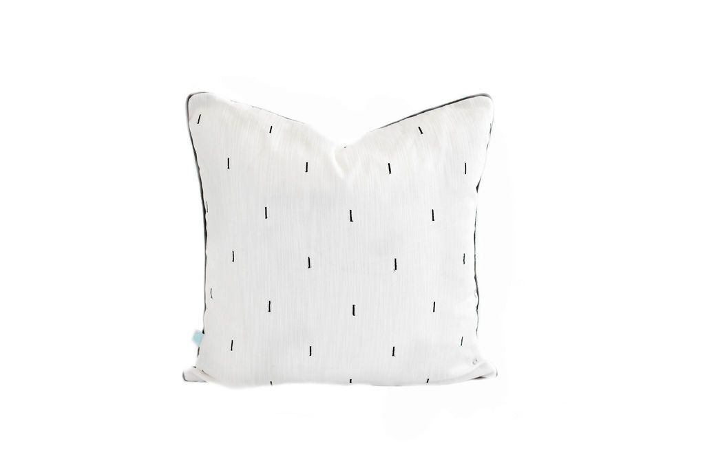 White pillow with black line pattern 