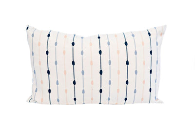 White pillow with vertical lines and dots