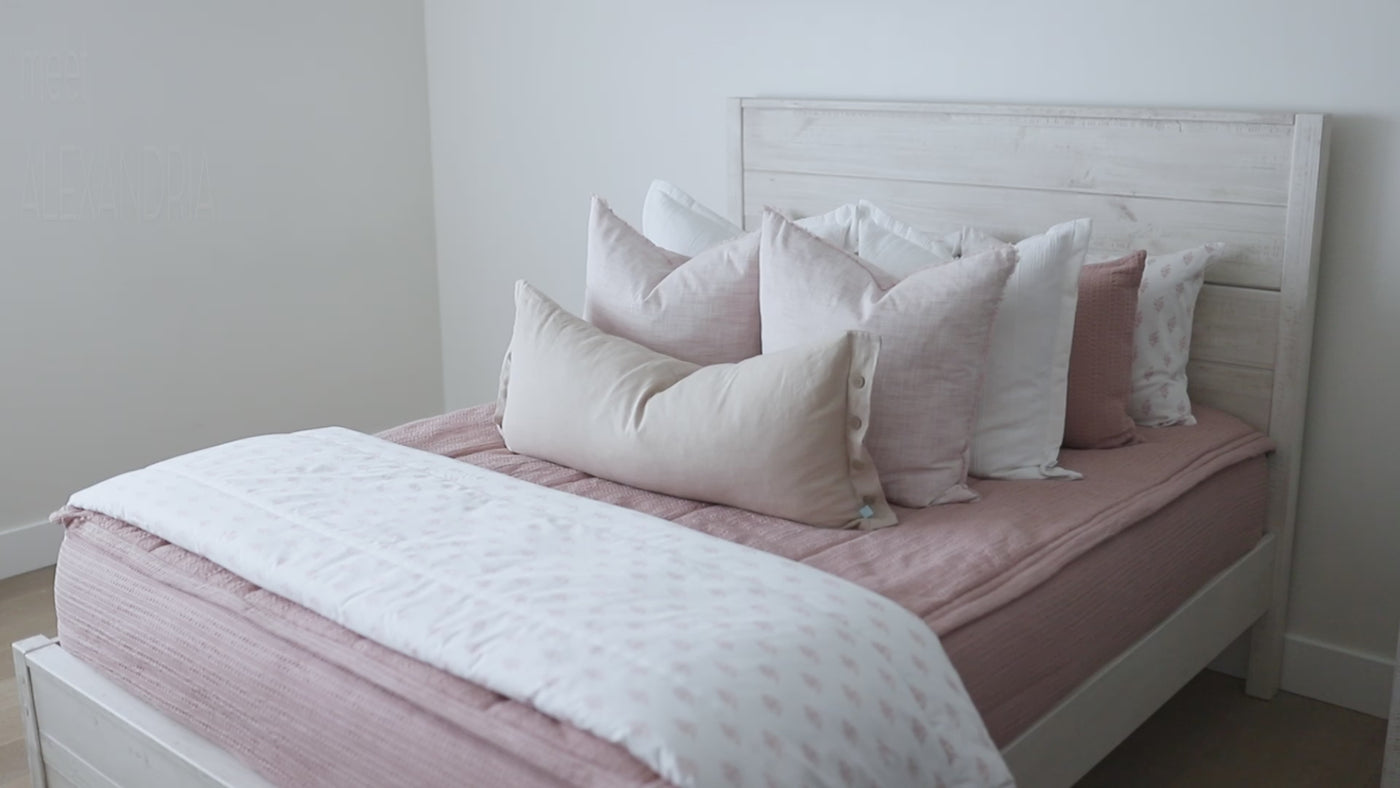 Video highlighting details of pink zipper bedding styled with pillows and blankets