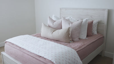 Video highlighting details of pink zipper bedding styled with pillows and blankets