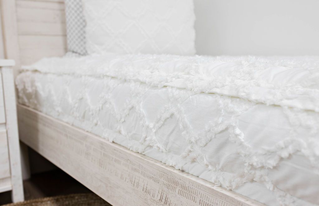 side view of White bedding with texturized diamond design