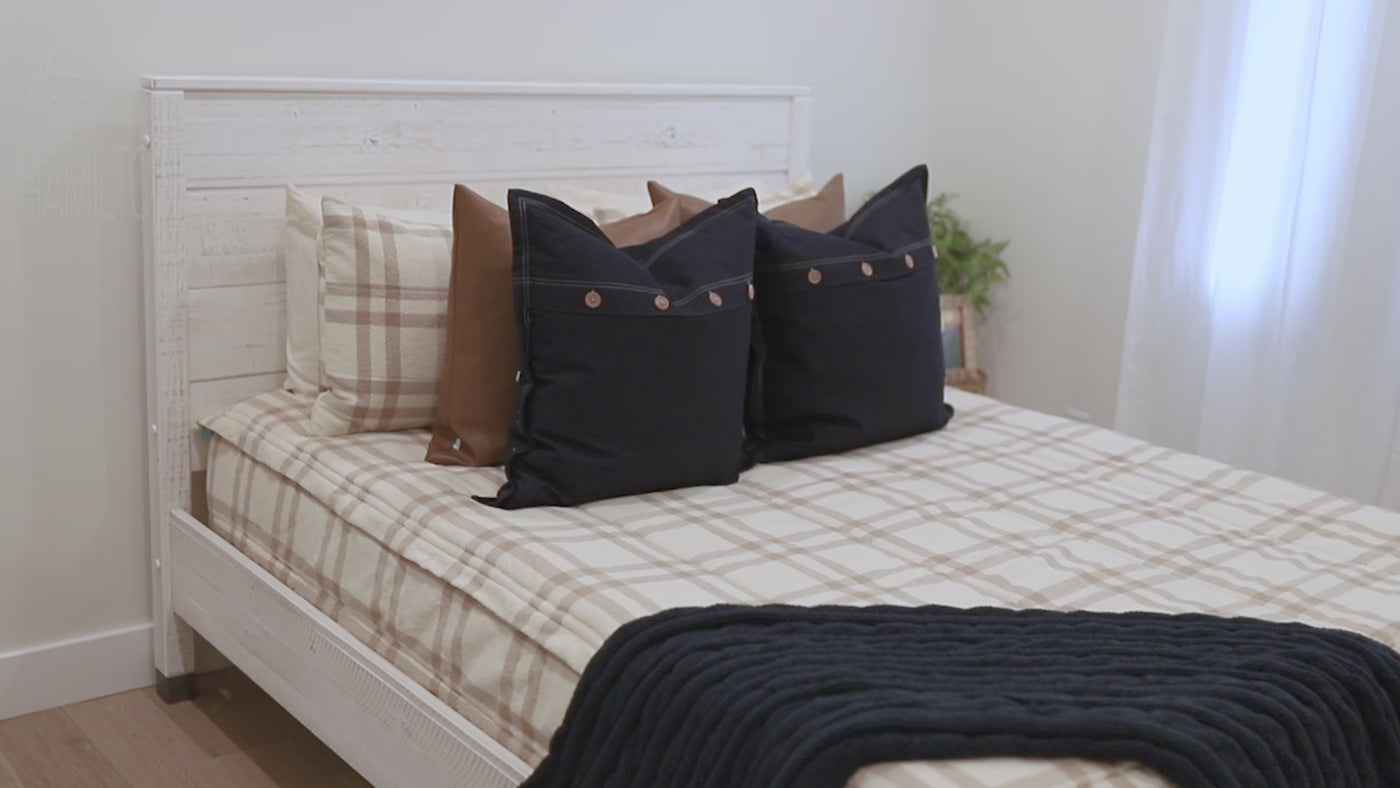 Video detailing Cream and brown plaid zipper bedding with cream and matching pillowcases and shams. Decorated with brown leather pillows and blue pillows and blue throw blanket