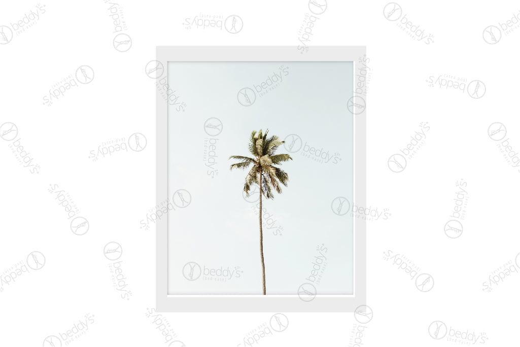 A single palm tree with a light blue sky background digital artwork showcased in a frame.