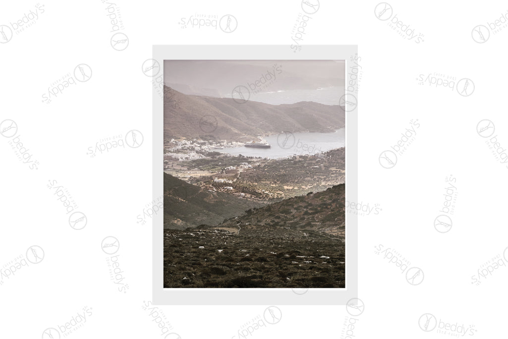 A bay landscape with a small town and boats in the distance digital artwork showcased in a frame. 