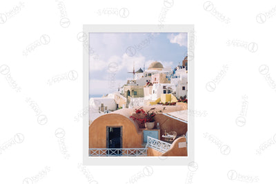 White, cream, yellow, and orange rounded and uniquely shape buildings digital artwork showcased in a frame. 