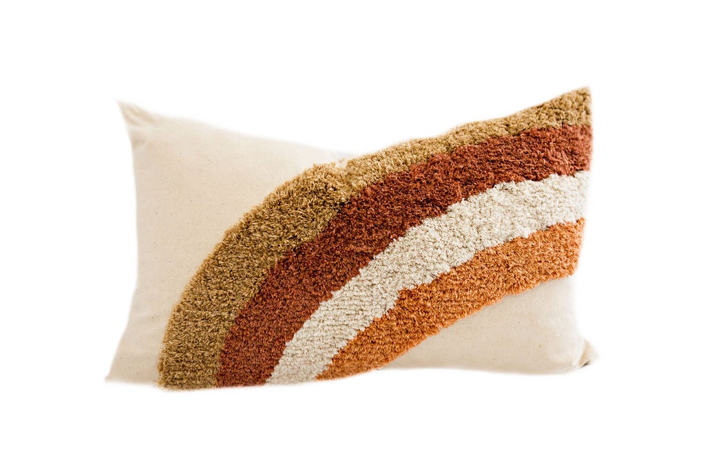 Cream textured pillow with a rainbow 