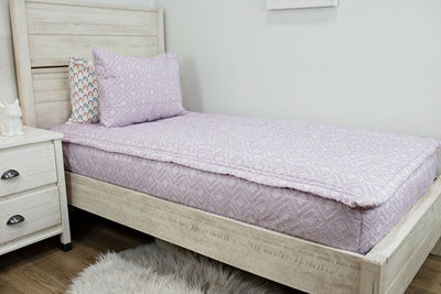 Purple textured zipper bedding with white rainbow pillowcase