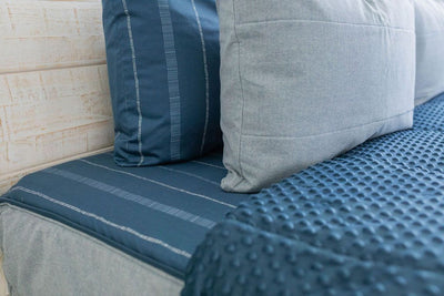 Blue pillow case on blue zipper bedding with matching pillow and dark blue minky inner lining 