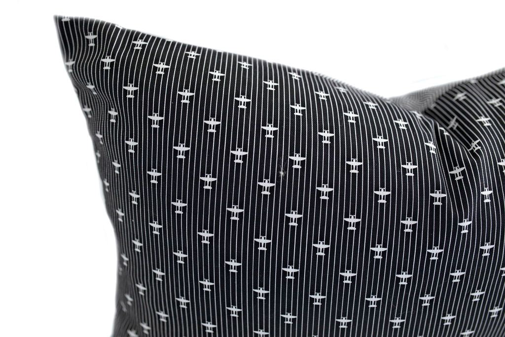 Close up of Black pillow with line and plane design