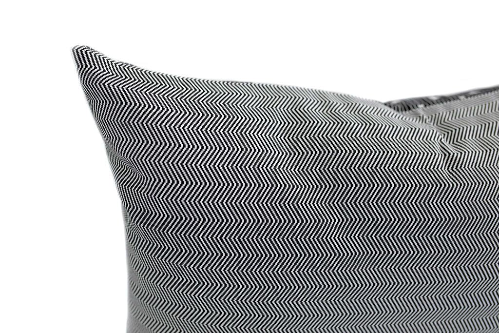 Close up of black and white zig zag pillow