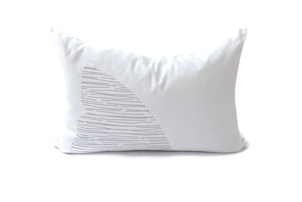 White lumbar pillow with a gray shark fin