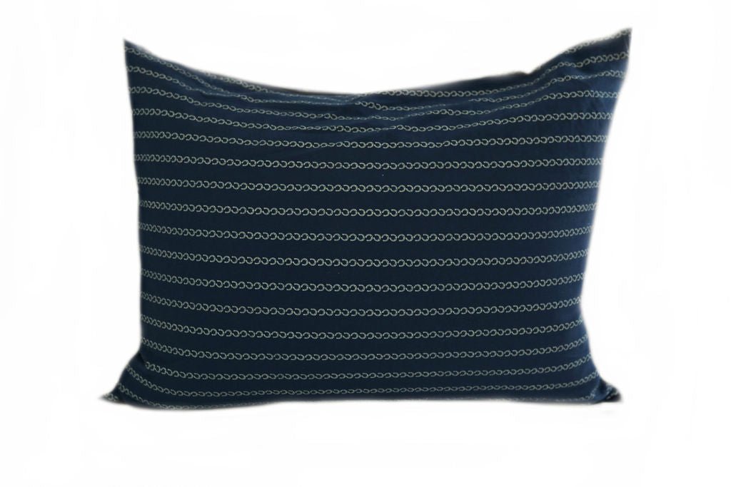 Blue pillowcase with small horseshoes creating stripes
