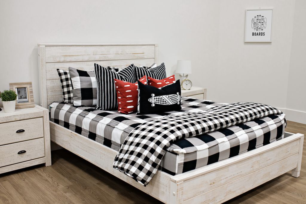 Black and white checker zipper bedding and blanket styled with matching pillows