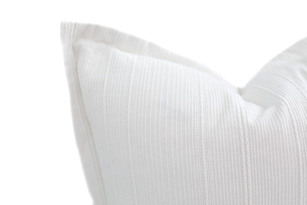 White euro decorative pillow close up highlighting textured lines
