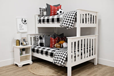 Black and white checker zipper bedding and blanket on bunkbed styled with matching pillows