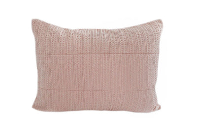 A woven pink textured sham pillow.