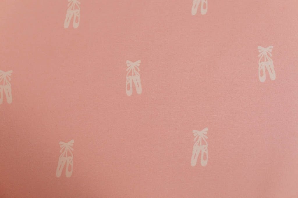 A close up of the interior of a set of pink ballet shoes kids zipper bedding.