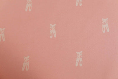 A close up of the interior of a set of pink ballet shoes kids zipper bedding.