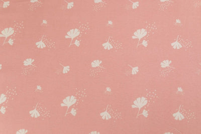 A close up of the interior of a set of pink, blue, and yellow floral kids zipper bedding.