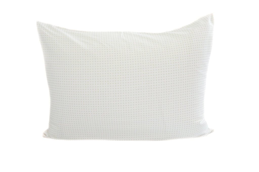 A white pillowcase with a faint gray dot design. 