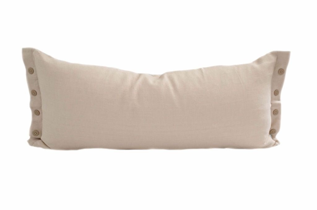 Cream lumbar pillow with brown buttons