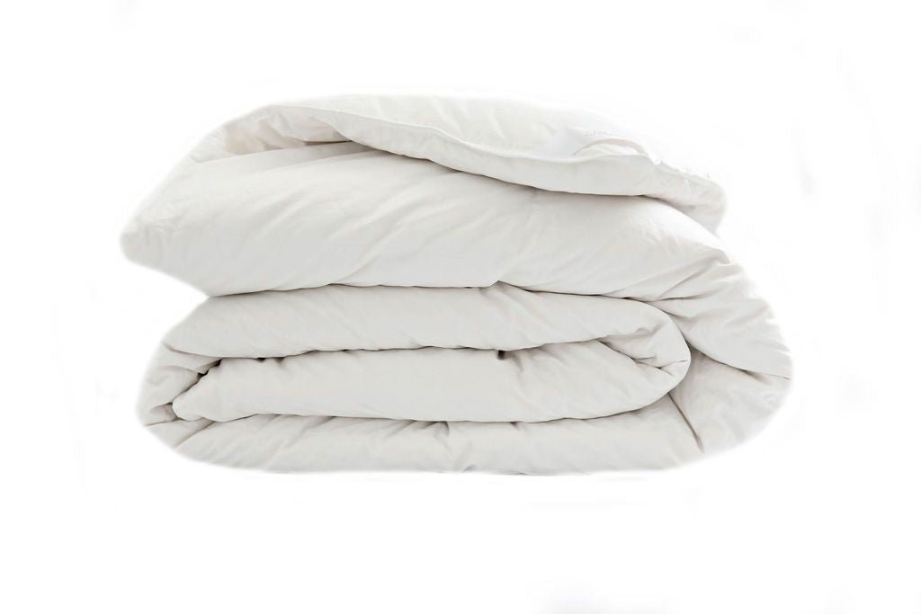 A side few of a white down duvet insert folded. 