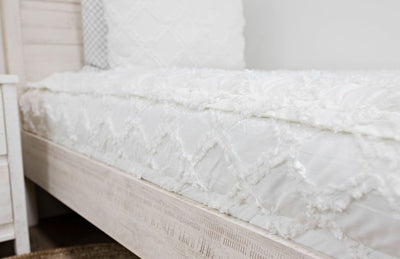 side of White bedding with textured diamond design